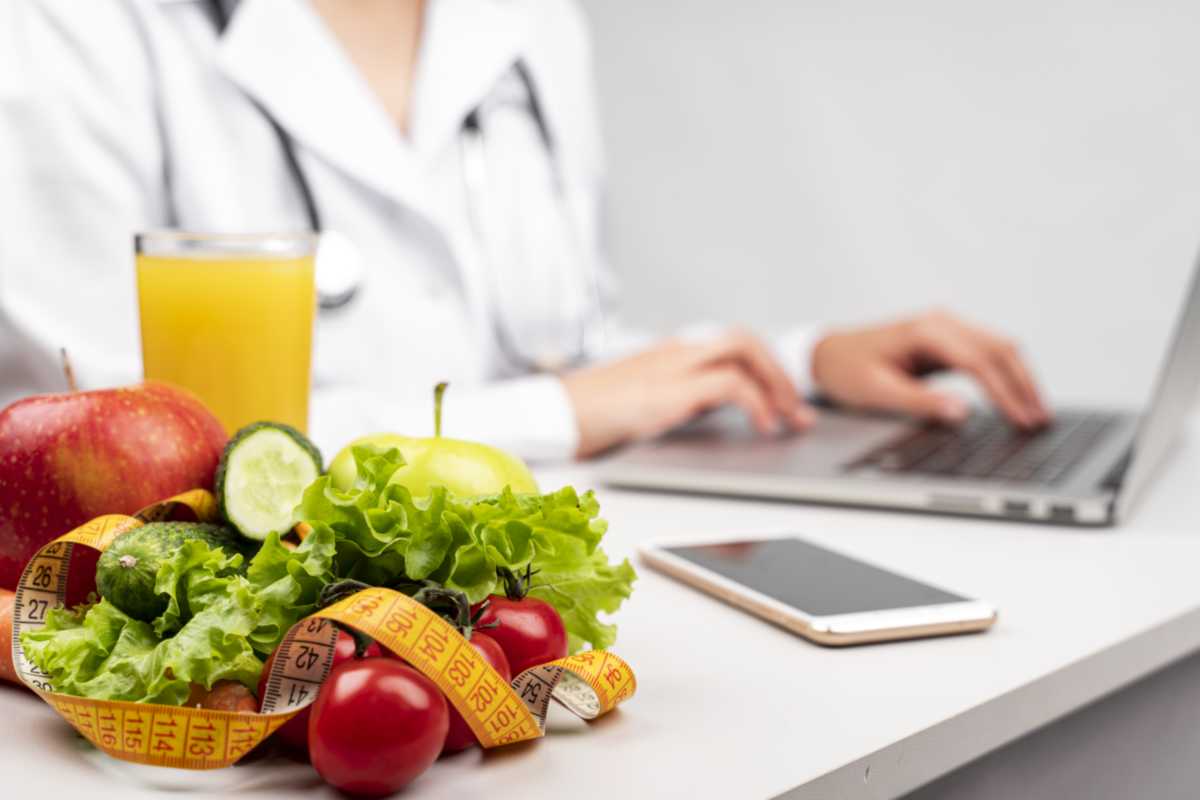 closeup of healthy food and female doctor in the background